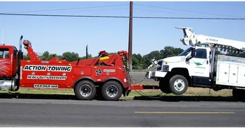 Two trucks of white and red colours on a road